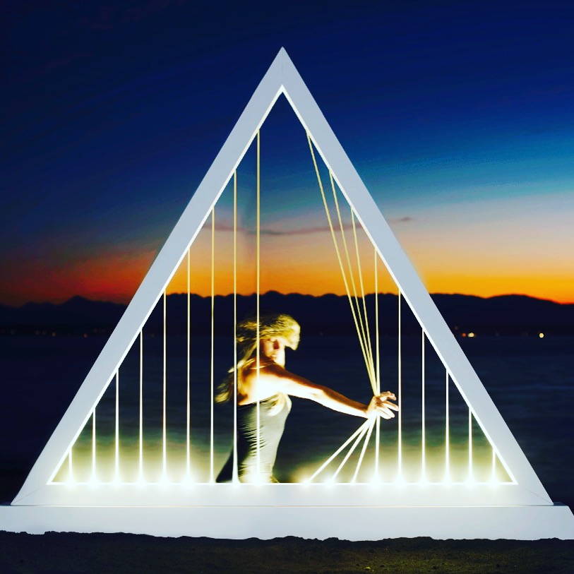 Elastic Light prototype — a glowing triangular sculpture of tactile, luminous strands